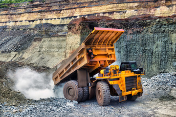 large mining loader unloads extracted ore or rock.