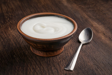 Homemade yogurt on the background of a wooden rustic table