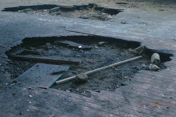 Part of the burnt wooden floor of the boards.