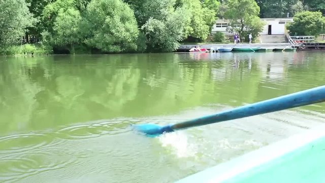rowing oars on a boat on the lake in the Park
