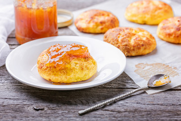 Cottage cheese pancakes baked in the oven. Russian dessert  syrniki with jam. 
