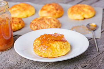 Cottage cheese pancakes baked in the oven. Russian dessert  syrniki with jam. 