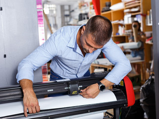 male worker paper print work place
