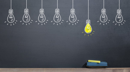 idea concept, yellow lamp on blackboard