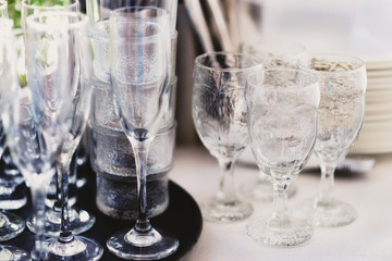Empty and clean crystal glasses and goblets on a table
