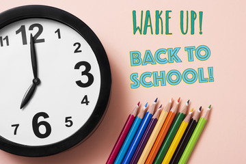 pencil crayons, clock and text back to school.