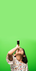 Cute little Indian/asian girl using stretch telescope and looking up in the sky, want to be a...
