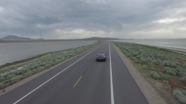 Black Car on Roadway &ndash; Follow