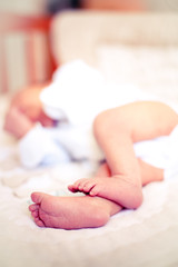 Obraz na płótnie Canvas Newborn baby boy sleeping on burlap blanket
