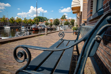 View from vintage bench over old harbor in dutch town