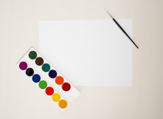 Artist holding a white paper. Top view. can place you. text ad information