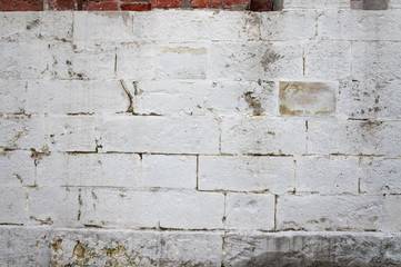 The texture of the whitewashed brick