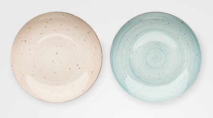 Empty pink ceramic plates isolated