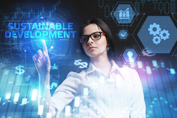 The concept of business, technology, the Internet and the network. A young entrepreneur working on a virtual screen of the future and sees the inscription: Sustainable development