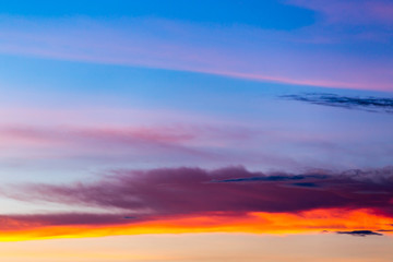 colorful dramatic sky with cloud at sunset.