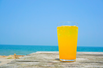 Orange juice drinking on the beach.  ビーチで飲むオレンジジュース