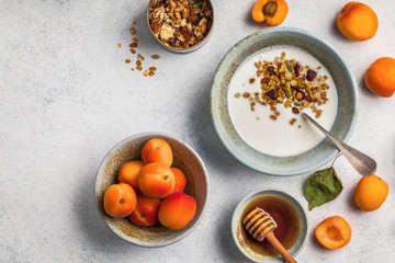 ealthy breakfast. Yogurt with granola and apricots