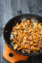 Fried chanterelle mushrooms in a cast iron pan