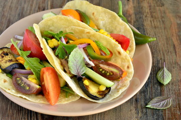 Vegetarian tortilla tacos with grilled vegetables and corn