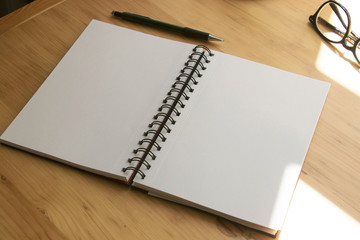 Notebook on a wooden table.