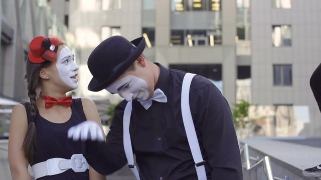 Funny mime want to scare his friends