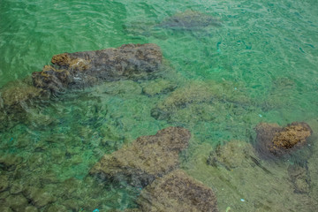 resort blue and green sea water surface waterfront district nature landscape empty environment concept with stones and small waves