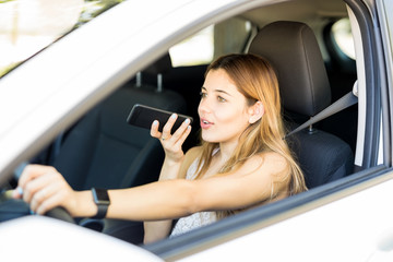 Woman making phone call while driving