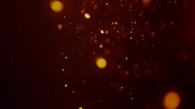 Abstract golden dust and smoke in slow-motion