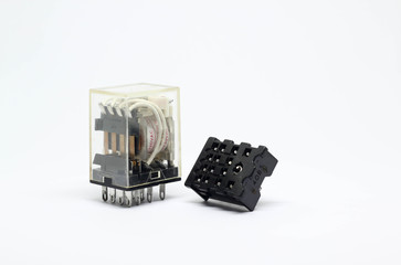 Electrical auxiliary relay in transparent plastic cases and black socket on white background.