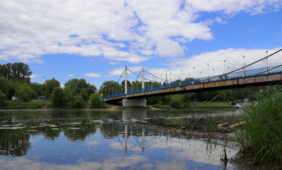 Fototapeta na wymiar Cable-stayed bridge over the Kotorosl river in Yaroslavl. View from the island of Damansky.