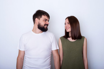Young couple smiling and looks each to other