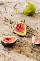 A few figs on old wooden background