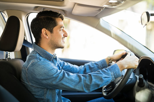 Young Guy Driving A Car Carefully