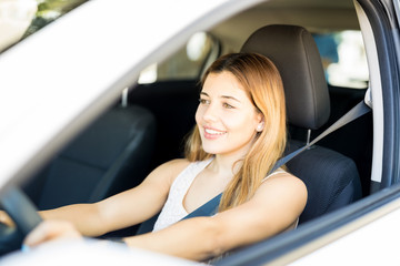 Attractive woman driving car