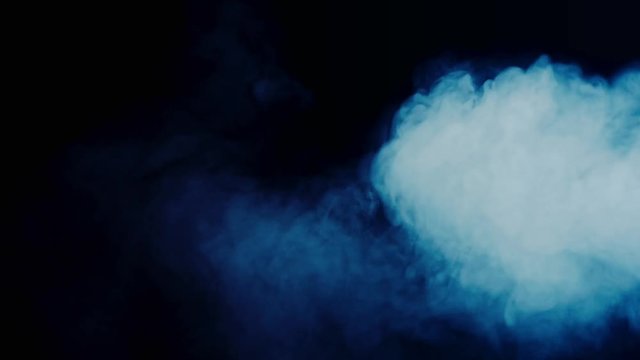 Abstract blue dust and smoke in slow-motion