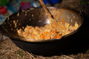 appetizing pilau in cauldron