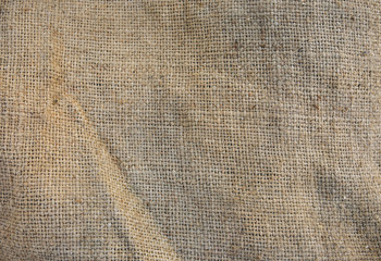 Old vintage linen cloth textile. Burlap rustic tumbled texture background.
