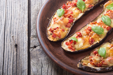 Eggplant with tomatoes , cheese and basil