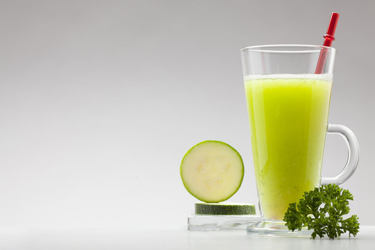 green smoothie on white background with blank space for text