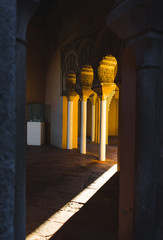Details of ancient decor. Alcazaba of Málaga, Andalusia, Spain. Sunbeams indoor. Mystical scene....