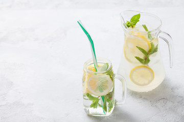 Citrus linfused emonade water with lemon sliced , healthy and detox water drink in summer. Health care, fitness, diet concept.