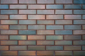 Brick wall of brown and blue color