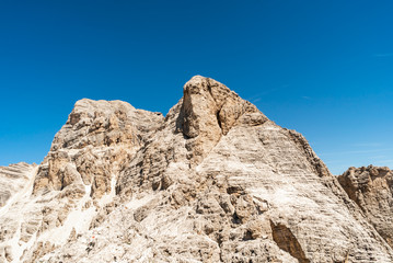  Via ferrata Tofana di Mezzo climbers on the ridge in the Dolomites, Group of climbers on the mountain top, Dolomite Alps, Italy. Silhouette of people climbing the mountain. Tiny Man Big Landscape 