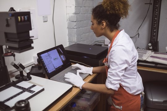 Female photographer developing photos