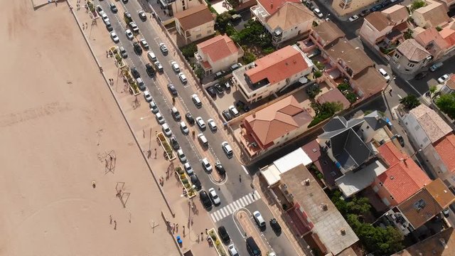 Aerial footage of the coastline and beach in Southern Europe in summer