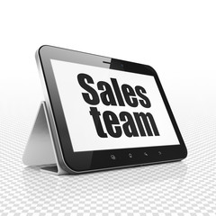 Advertising concept: Tablet Computer with  black text Sales Team on display,  Tag Cloud background, 3D rendering
