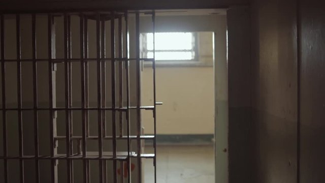 Dark Prison cell bars at day - dynamic shot