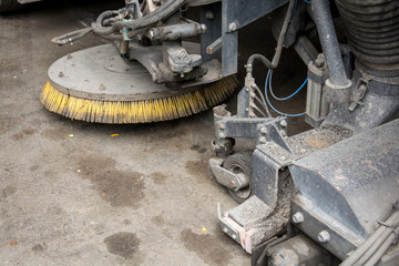 detail of a street sweeper machine car cleaning the road
