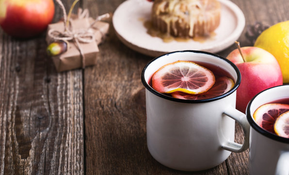 Cozy hot winter drink with lemon slices