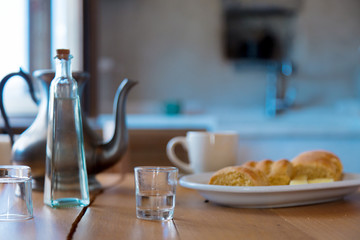 Traditional Crete breakfast, bread, cheese and coffee on wooden table on a kitchen. Crete, Greece